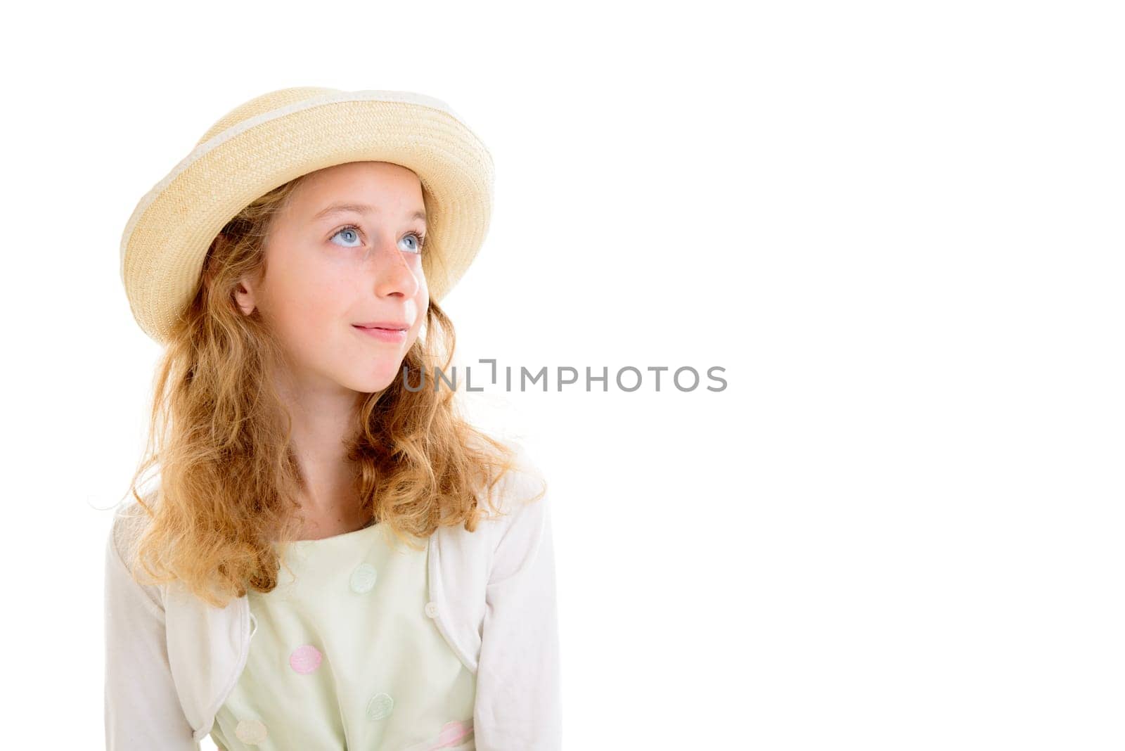 nice girl with blond hair in white dress and straw hat