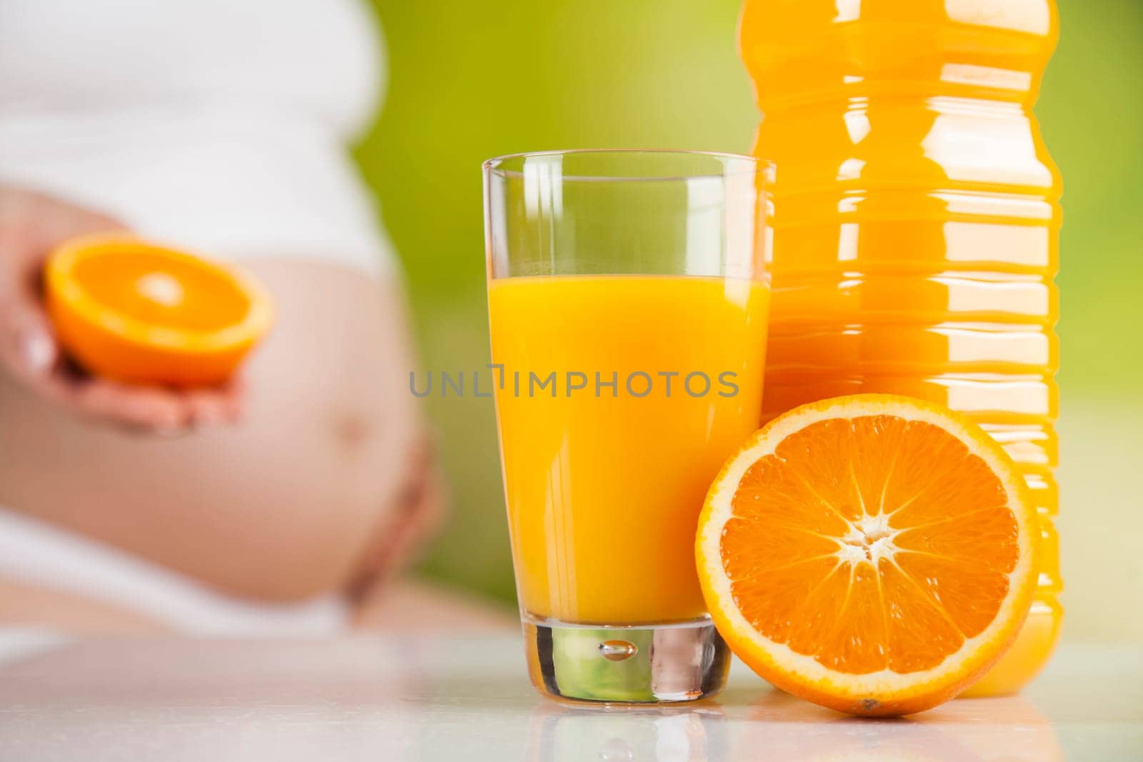 Pregnant woman with fruit and vegetables