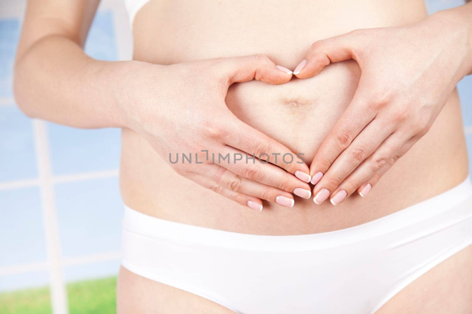Pregnant woman holding a heart
