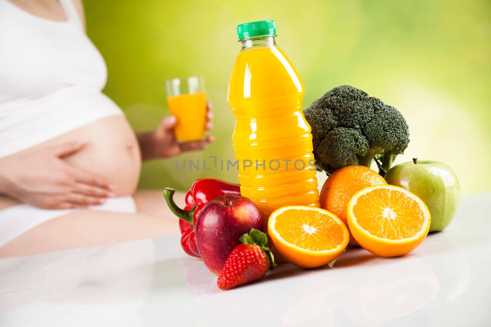 Pregnant woman with fruit and vegetables