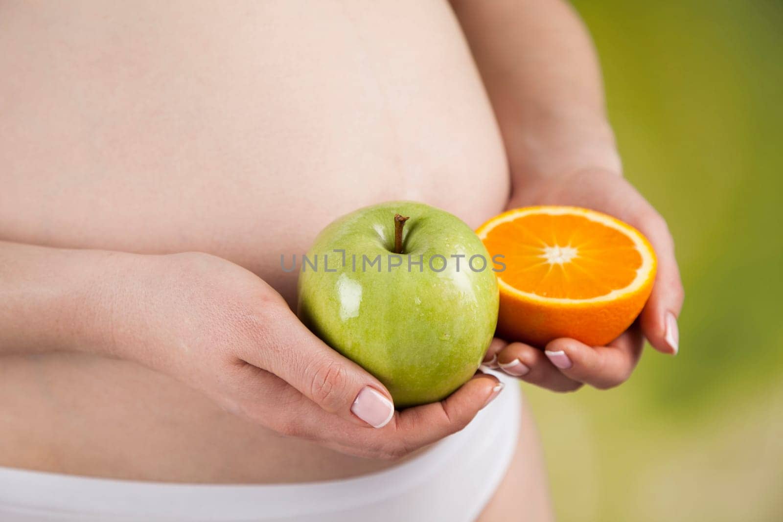 Pregnant woman with fruit and vegetables