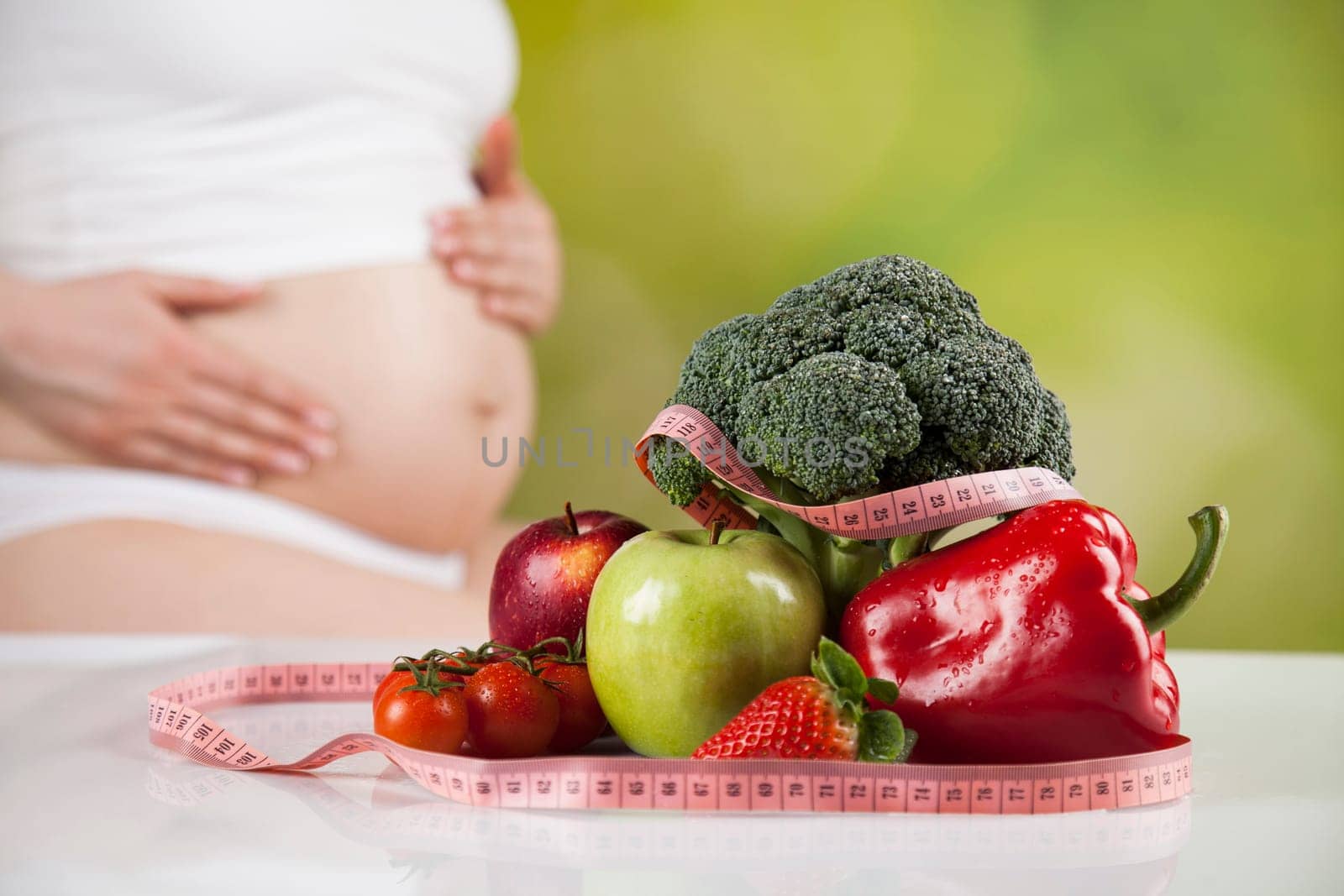 Pregnancy, healthy food and people concept