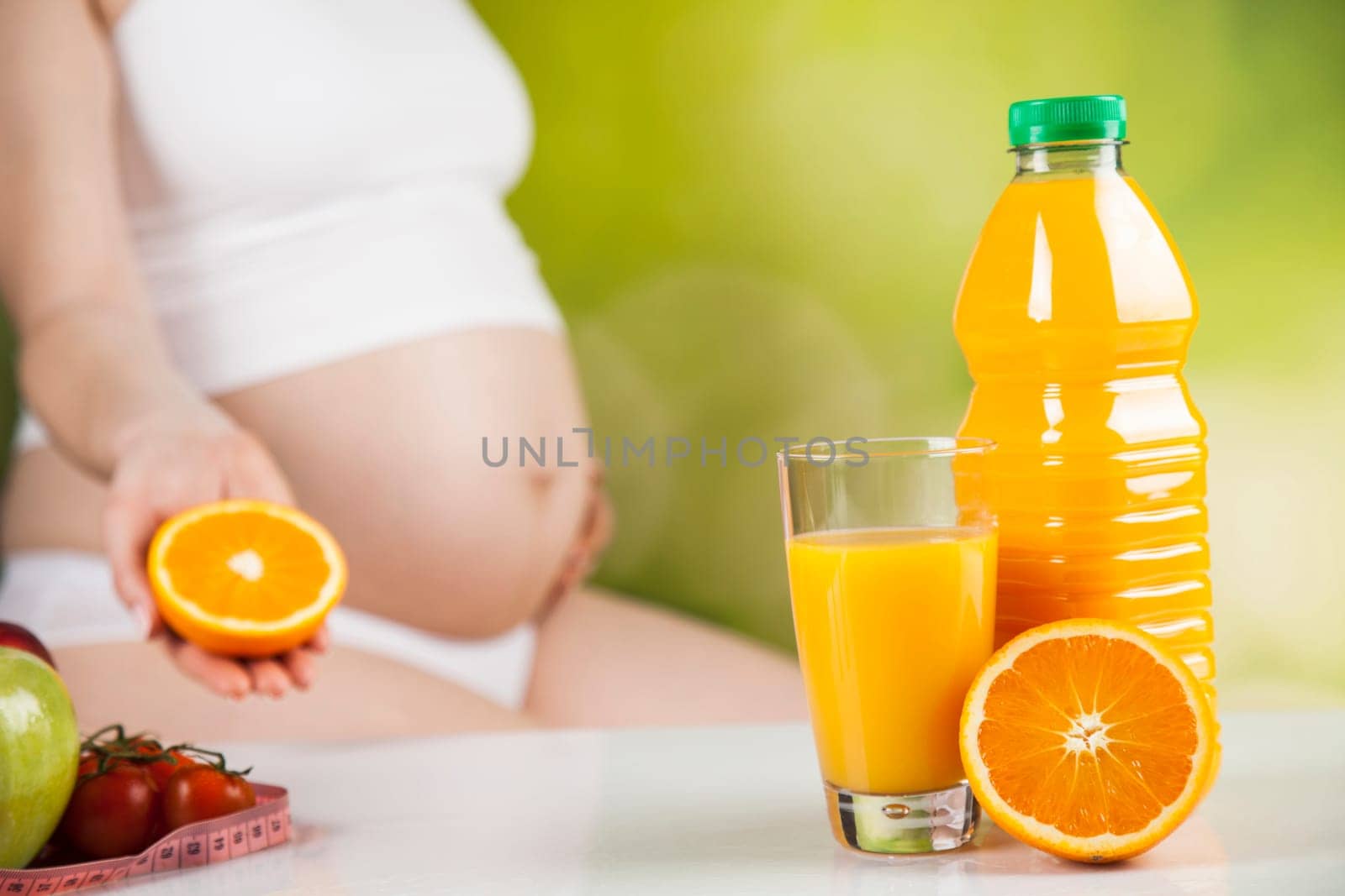 Pregnant woman with fruit and vegetables