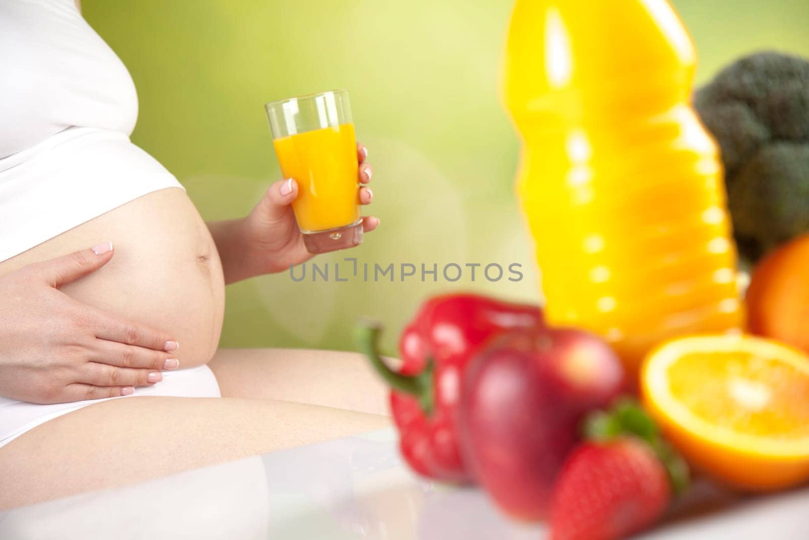 Pregnant woman with fruit and vegetables
