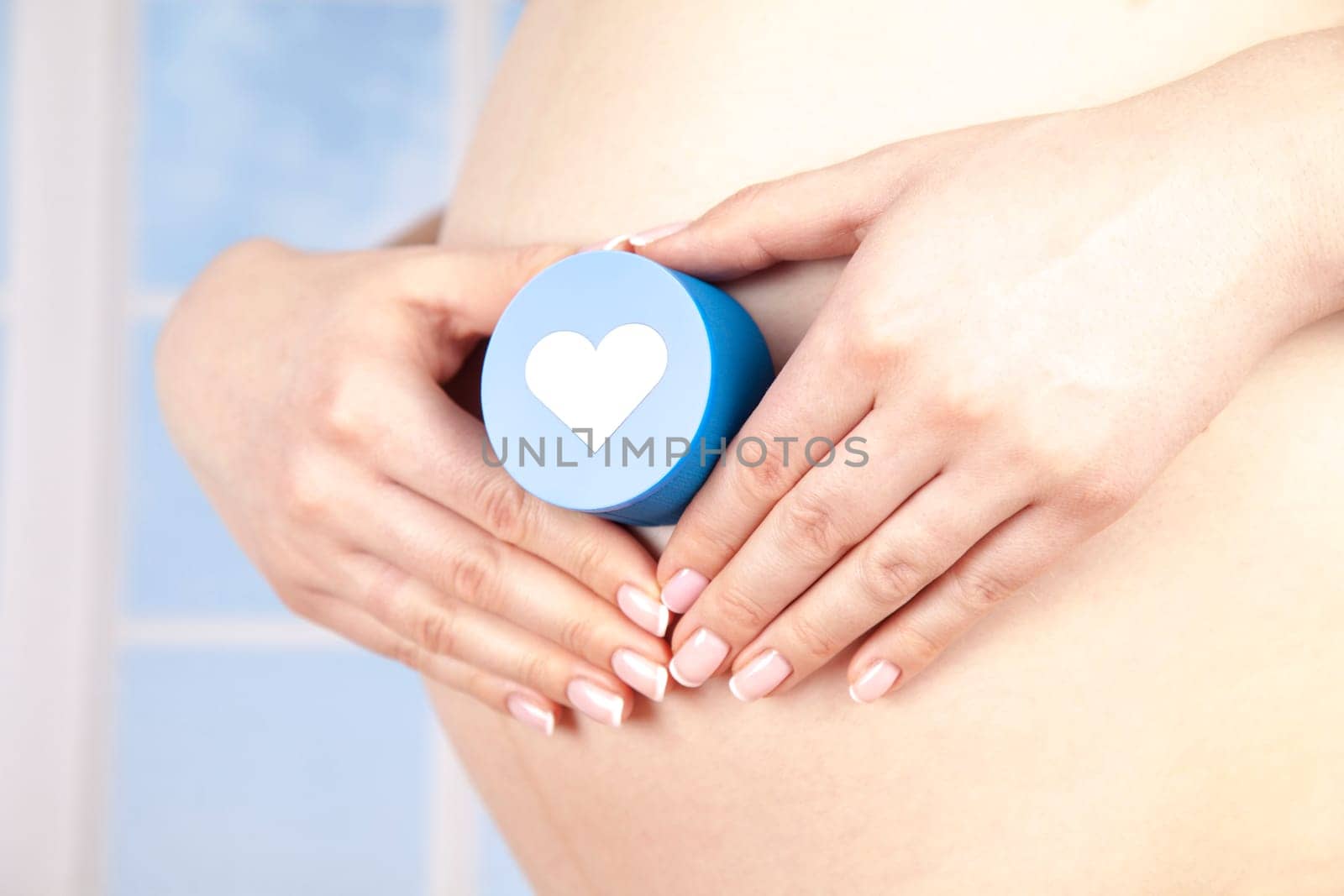Pregnant woman holding a heart