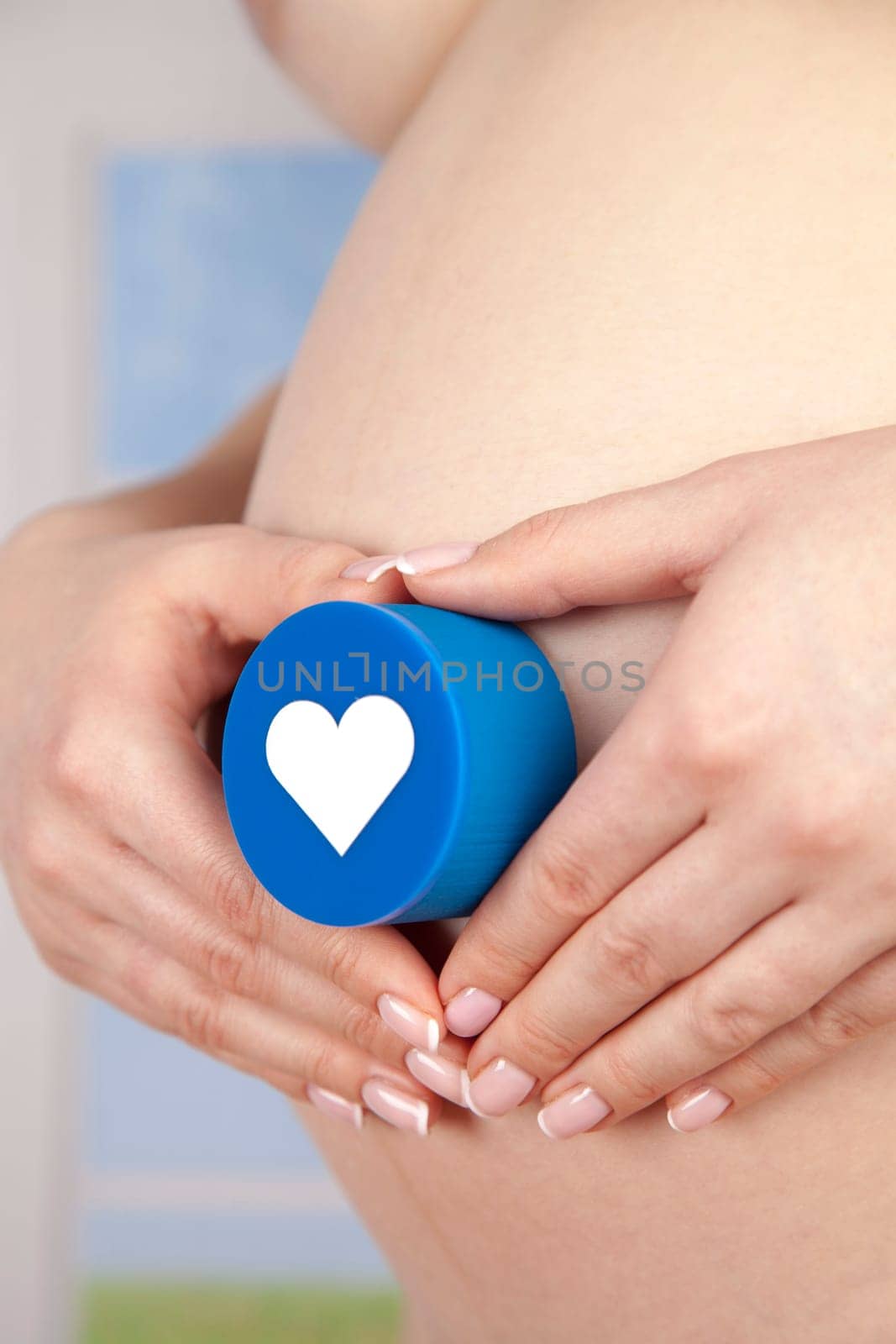 Pregnant woman holding a heart