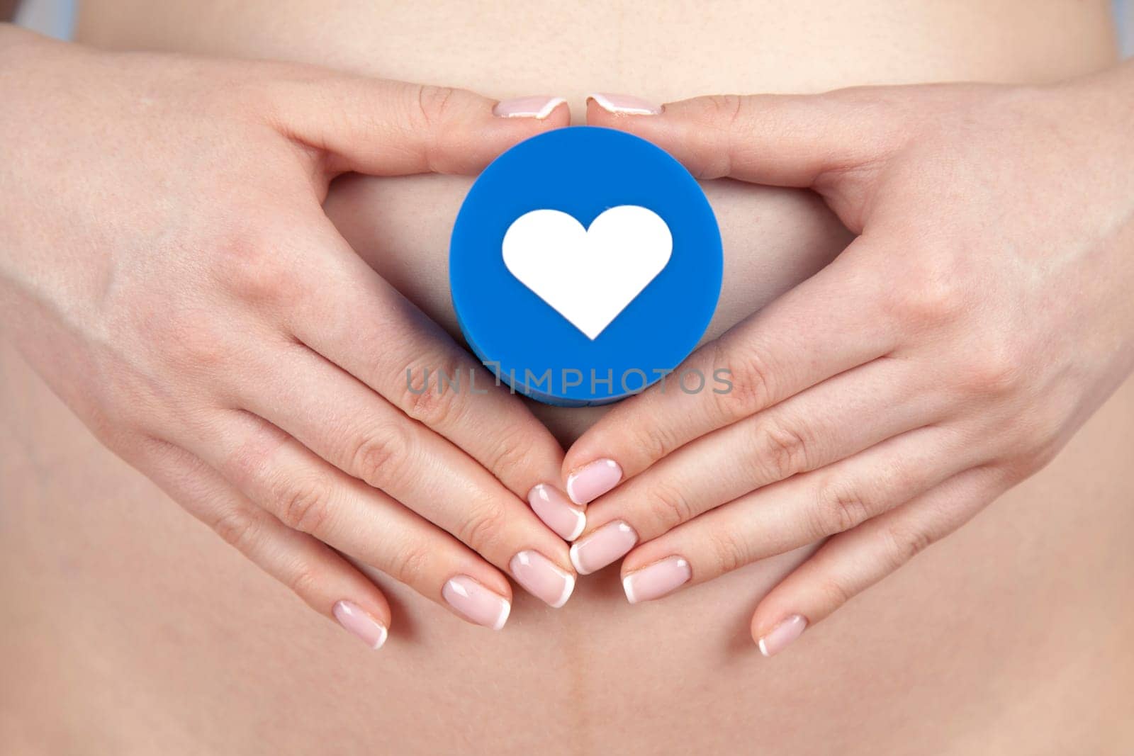 Pregnant woman holding a heart