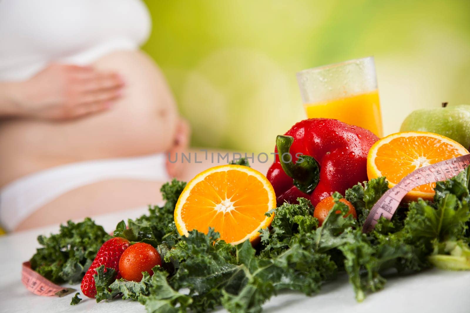 Pregnant woman with fruit and vegetables