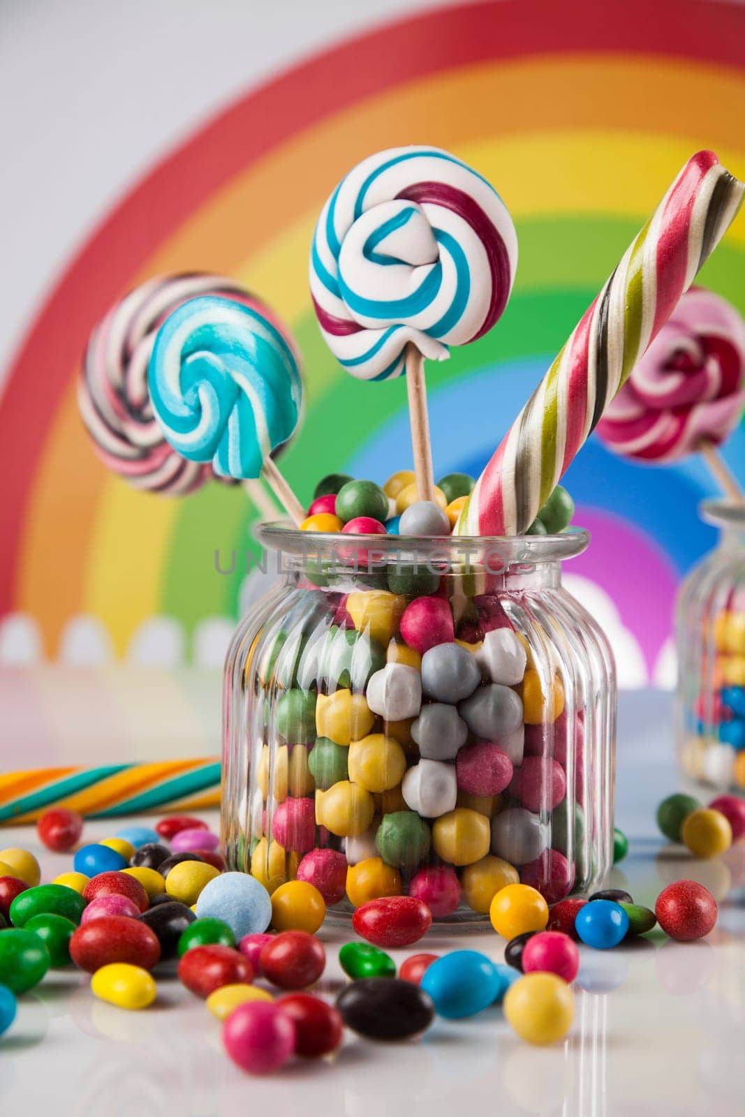 Glass jars in Colorful candies,lollipops and gum balls