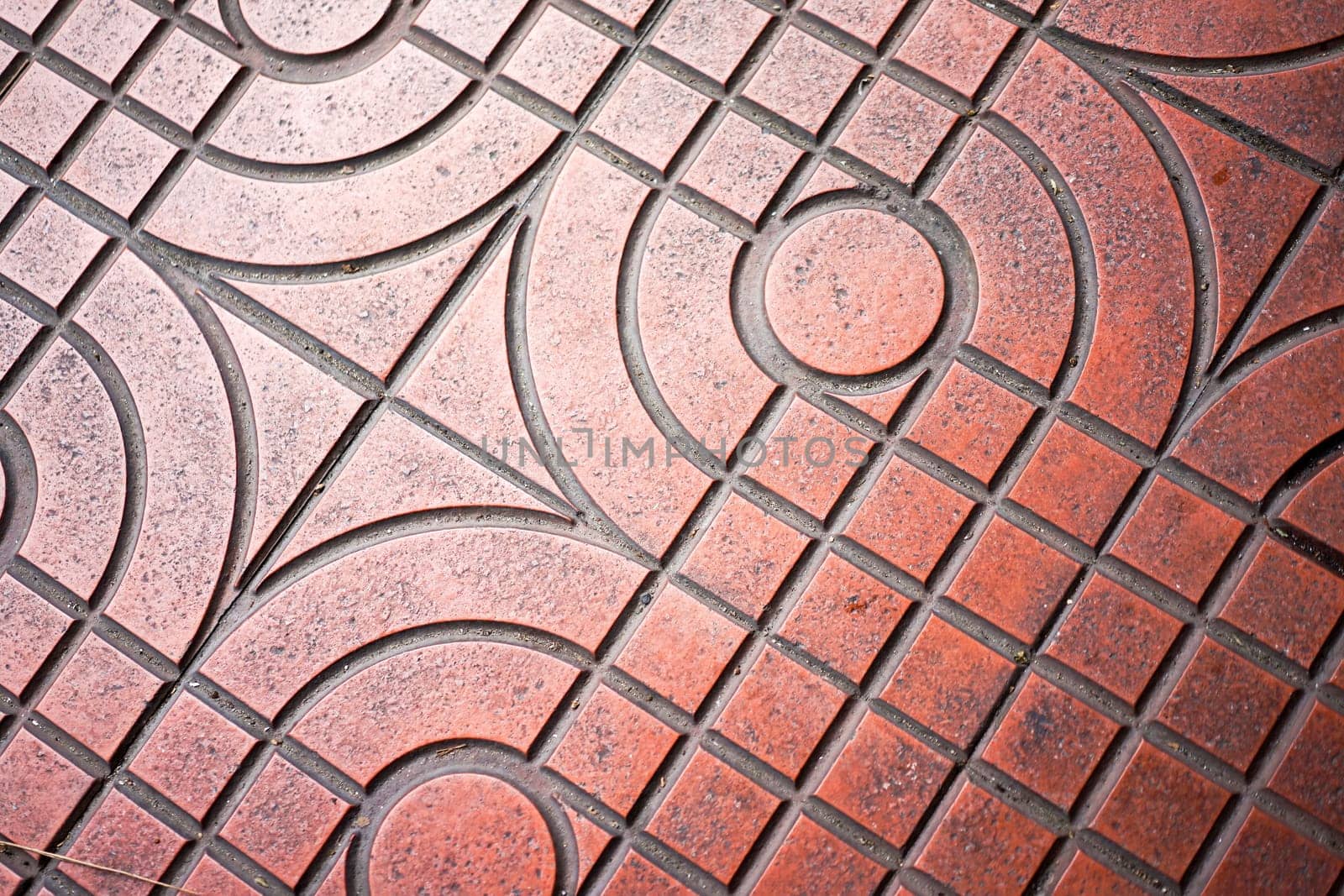 red tile on the floor at the public walkway