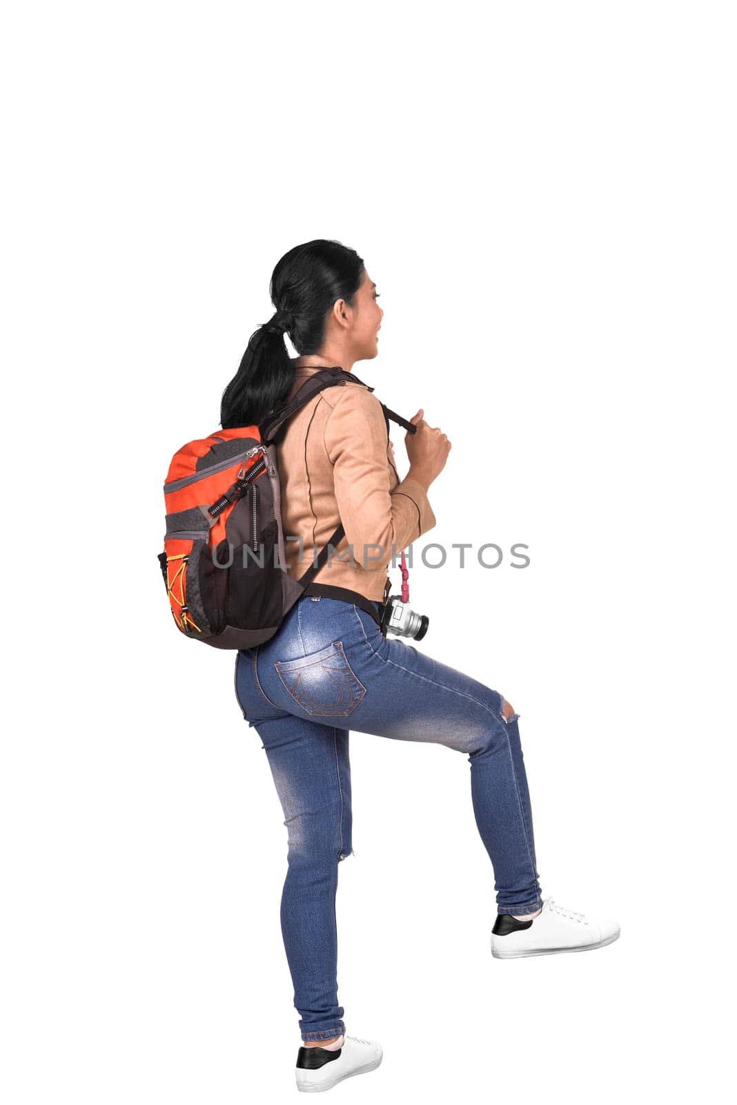 Rear view of asian traveler woman with backpack walking isolated over white background