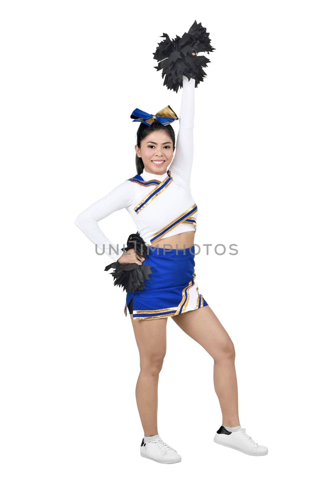 Pretty asian cheerleader with white suit and pom-poms standing isolated over white background