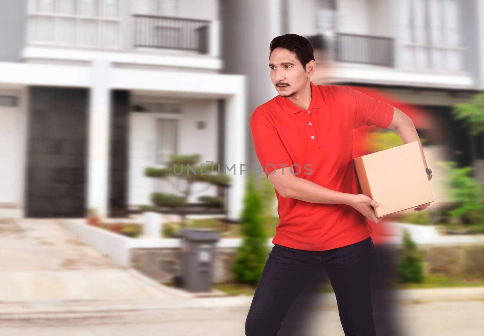Young asian courier man deliver the package to home