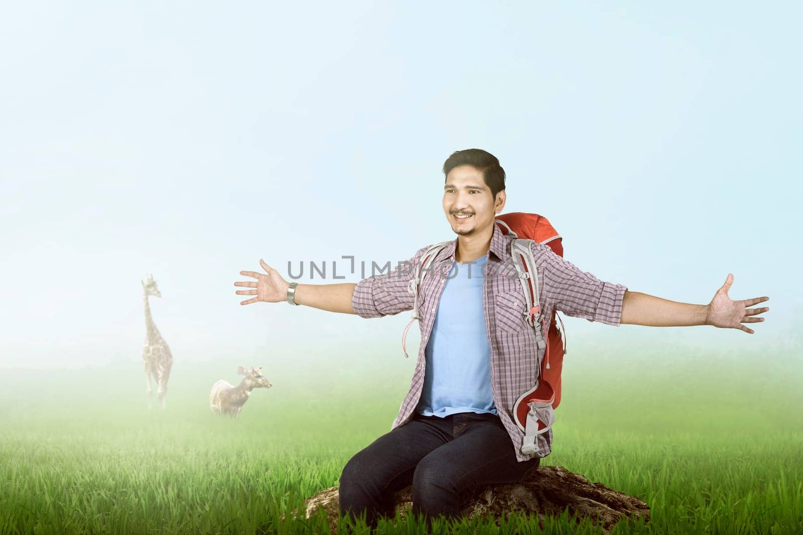 Happy asian traveler enjoying the scene with green grass background
