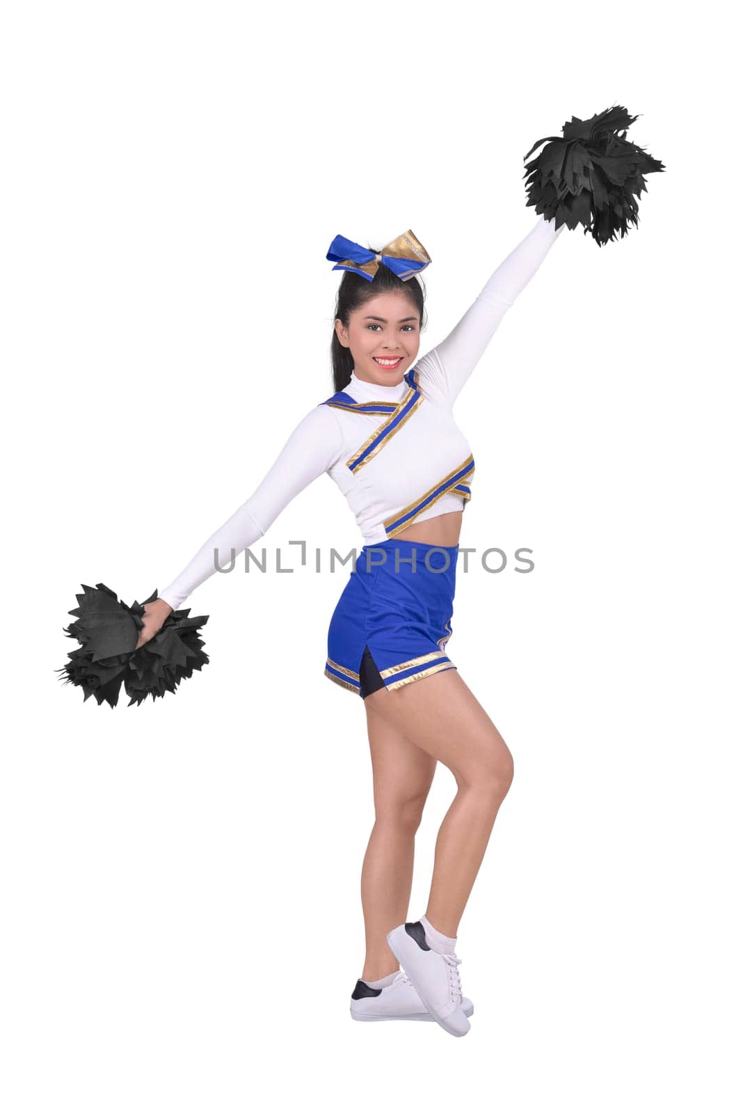 Portrait of smiling asian cheerleader isolated over white background