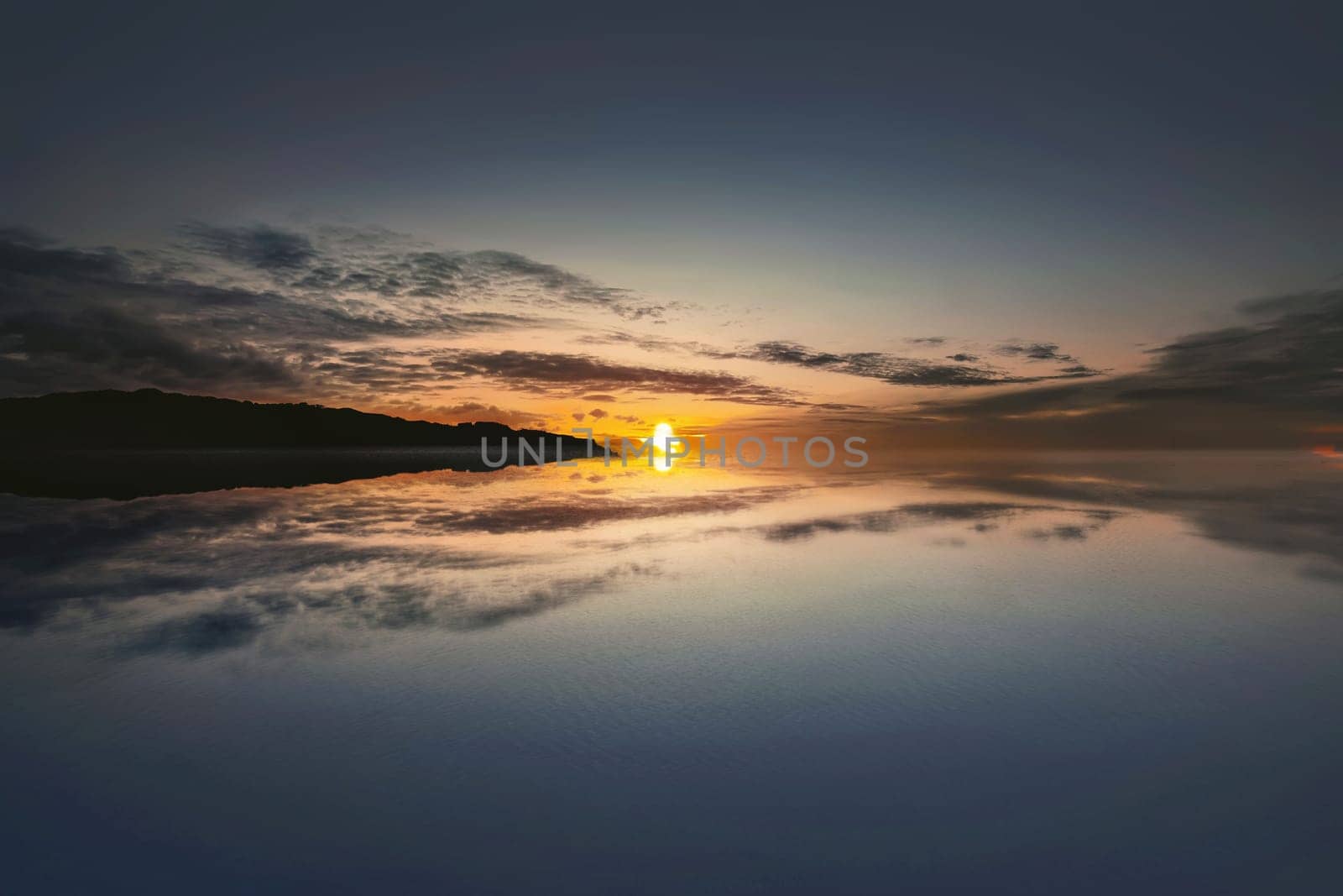 Beautiful sunrise on the ocean with dramatic sky background