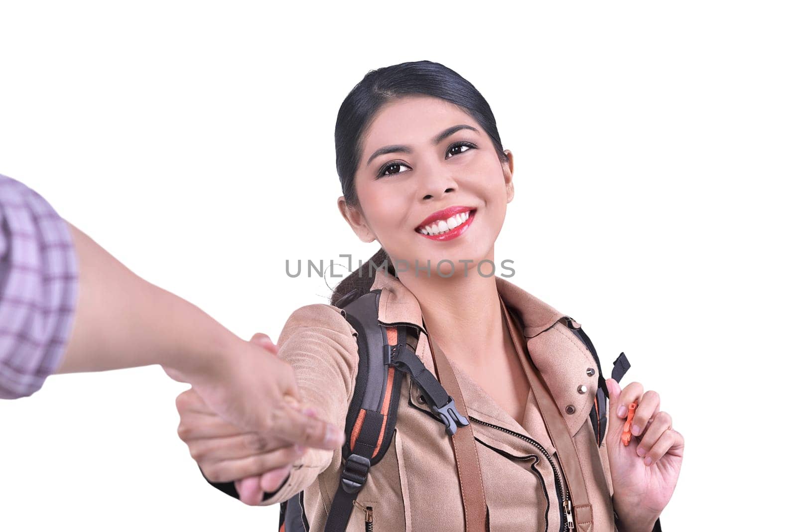 Portrait of asian traveling couple with woman holding hand of man posing isolated over white background