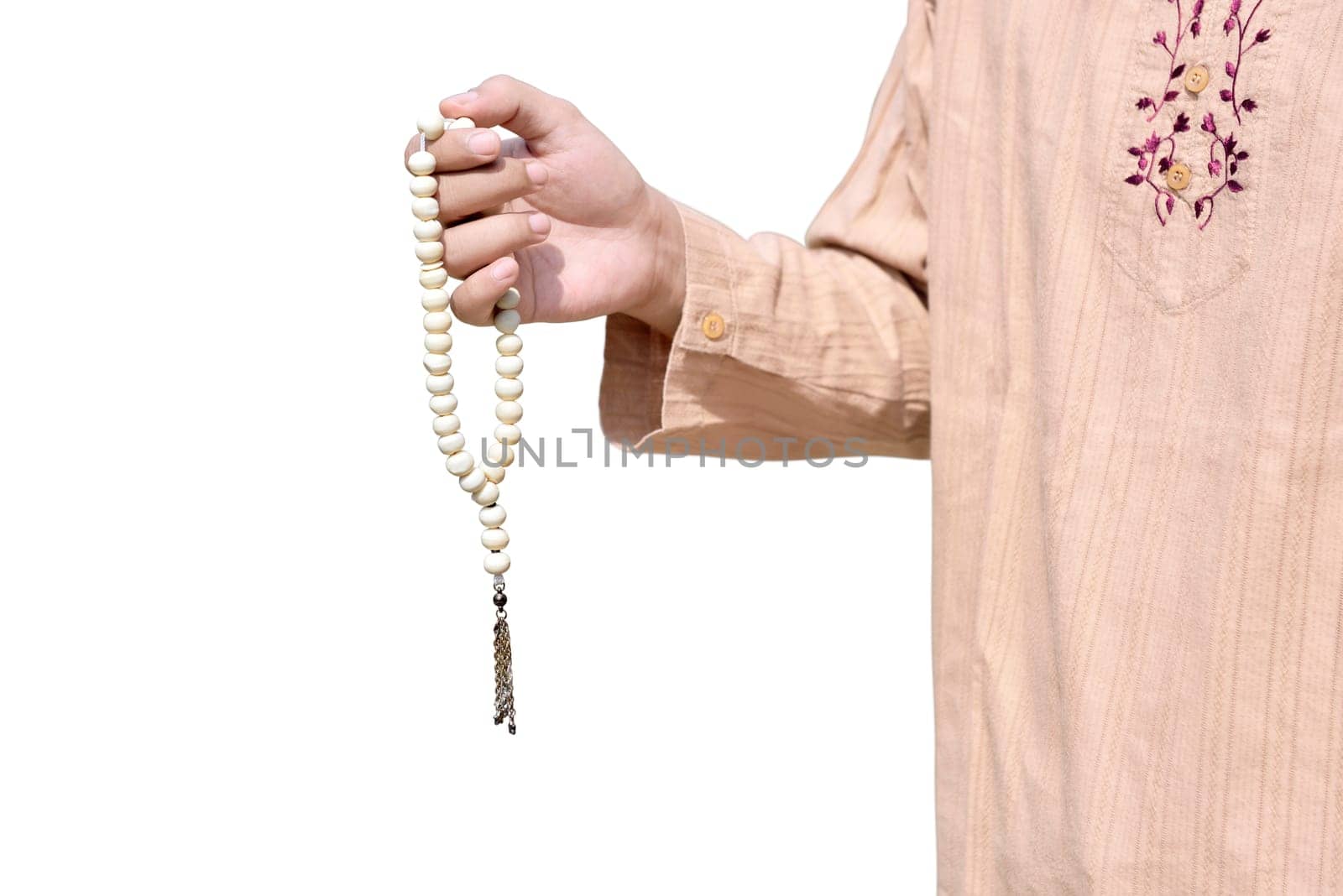 Muslim man holding prayer beads isolated over white background
