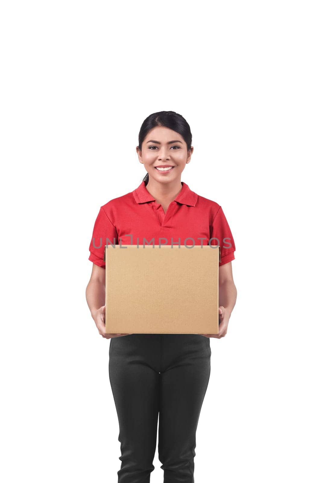 Smiling asian woman courier with cardboard box isolated over white background