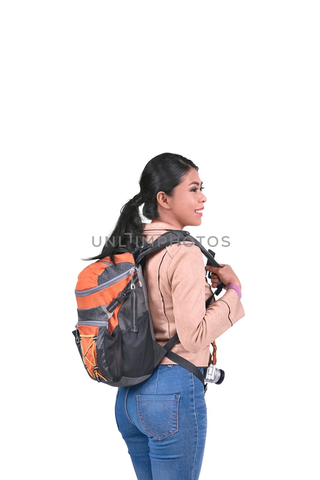 Portrait of asian tourist with backpack standing isolated over white background