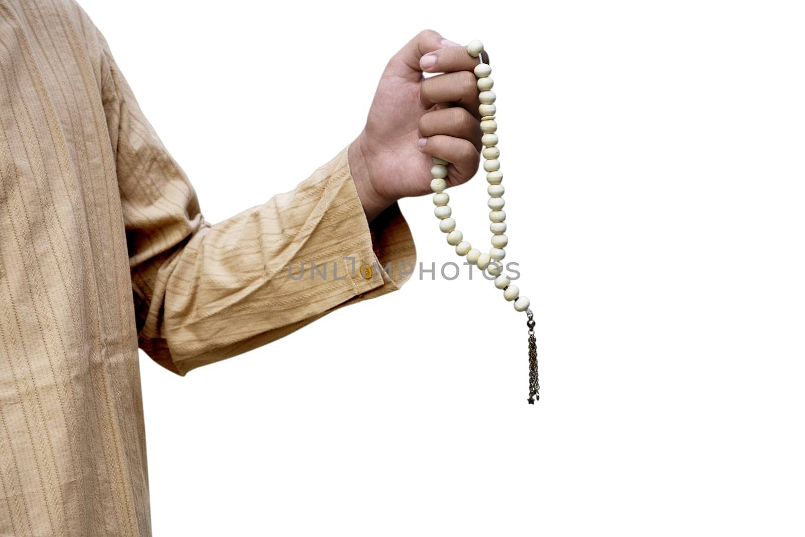 Muslim man holding prayer beads isolated over white background