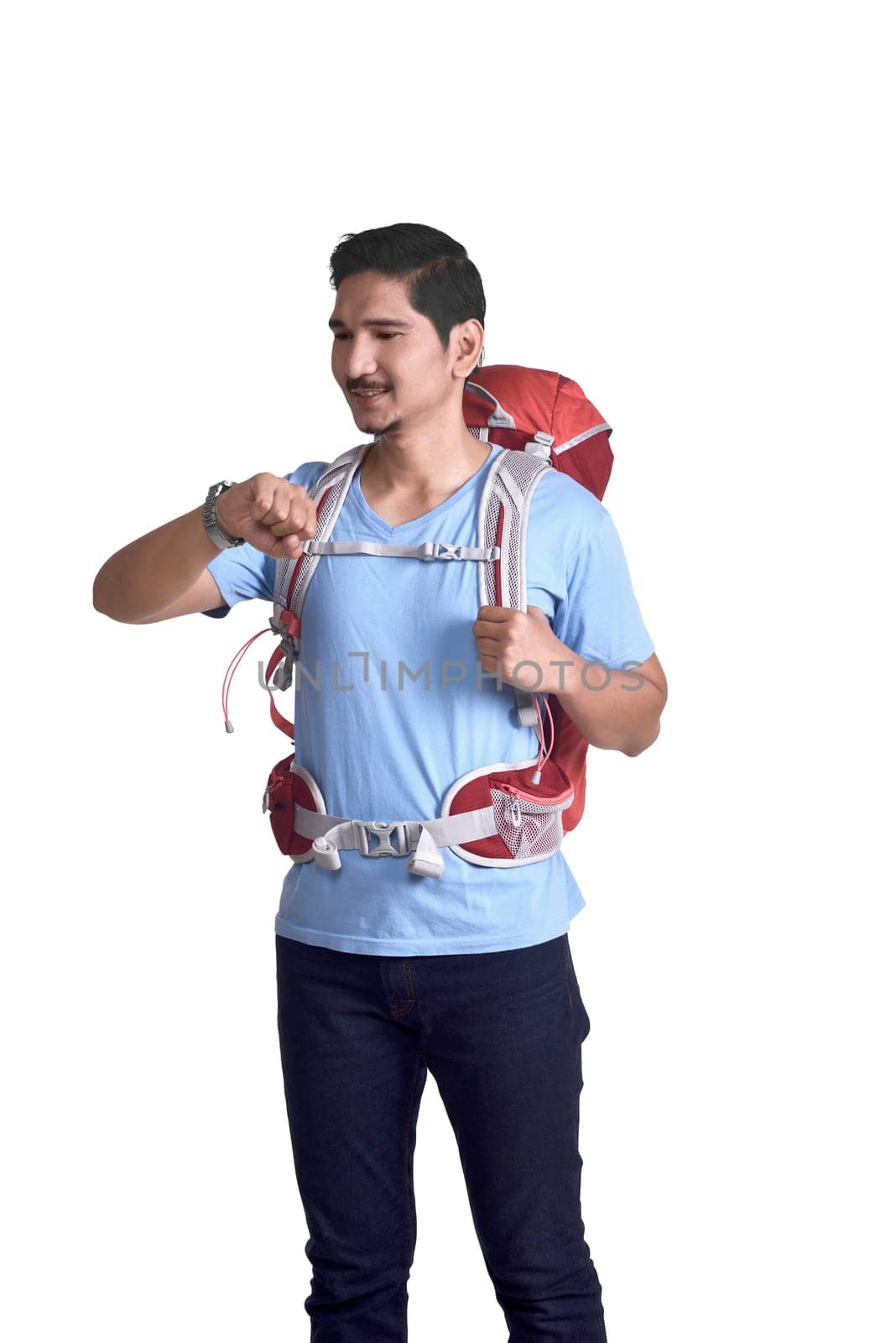 Portrait of asian traveler with backpack check the watch posing isolated over white background