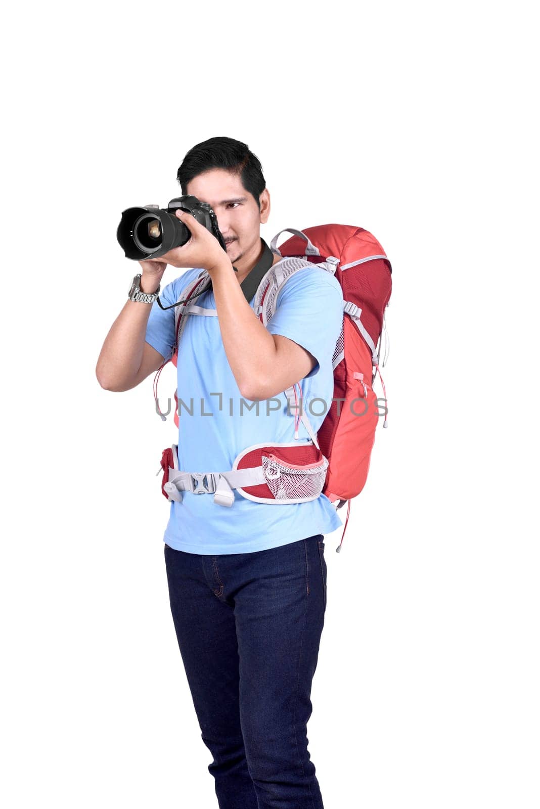 Portrait of asian traveler taking a photos with a camera isolated over white background