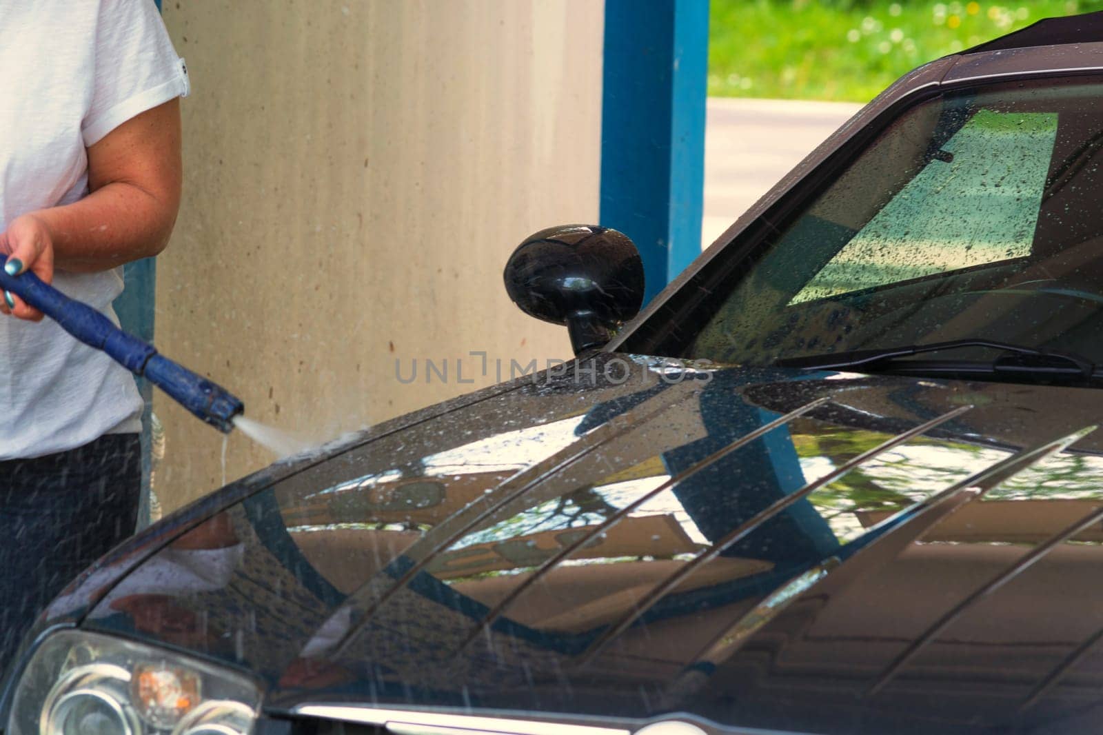 Clean car with a pressure washer..