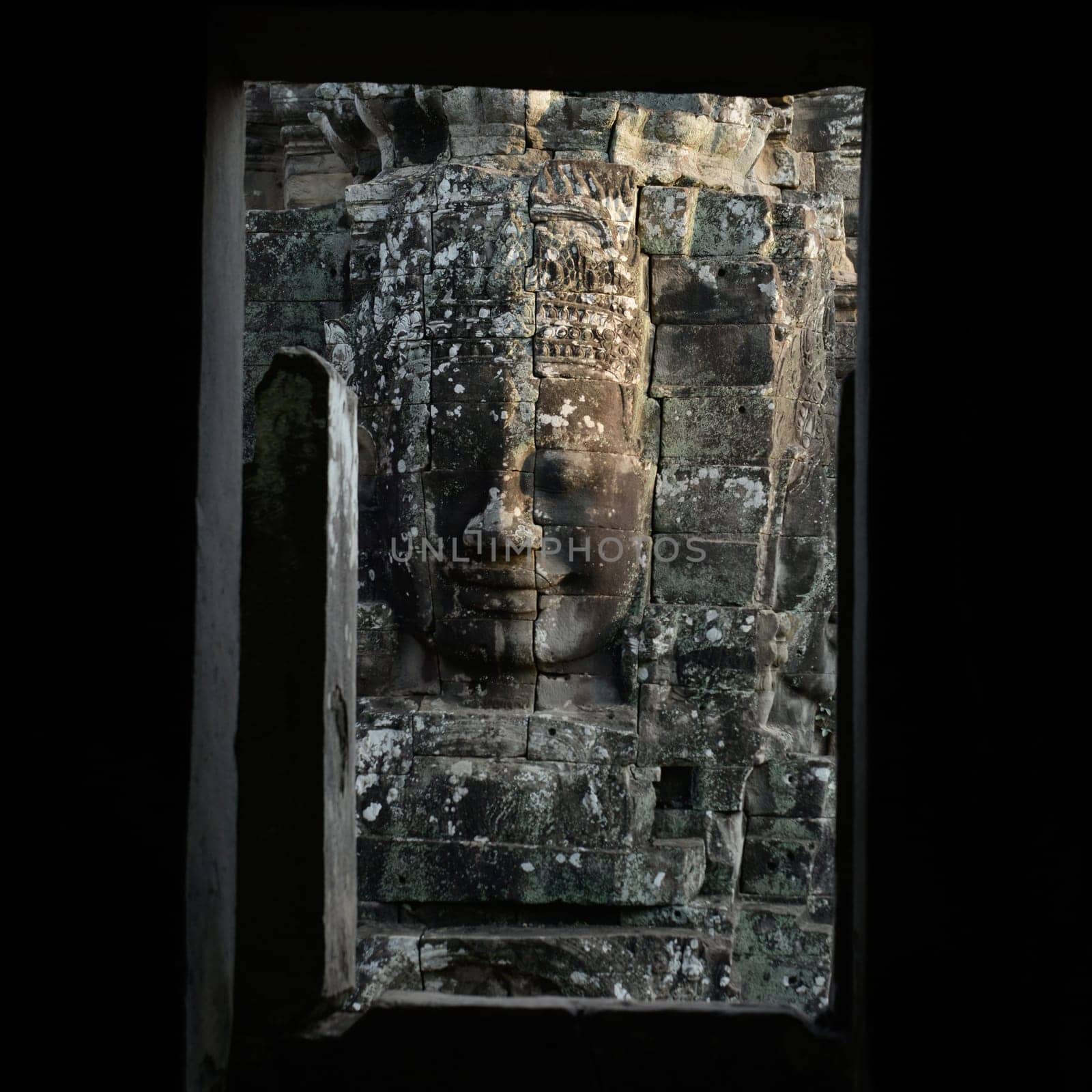 Stone Faces at the Bayon Temple the Tempel Ruins of Angkor Thom in the Temple City of Angkor near the City of Siem Reap in the west of Cambodia.  Cambodia, Siem Reap, April 2014