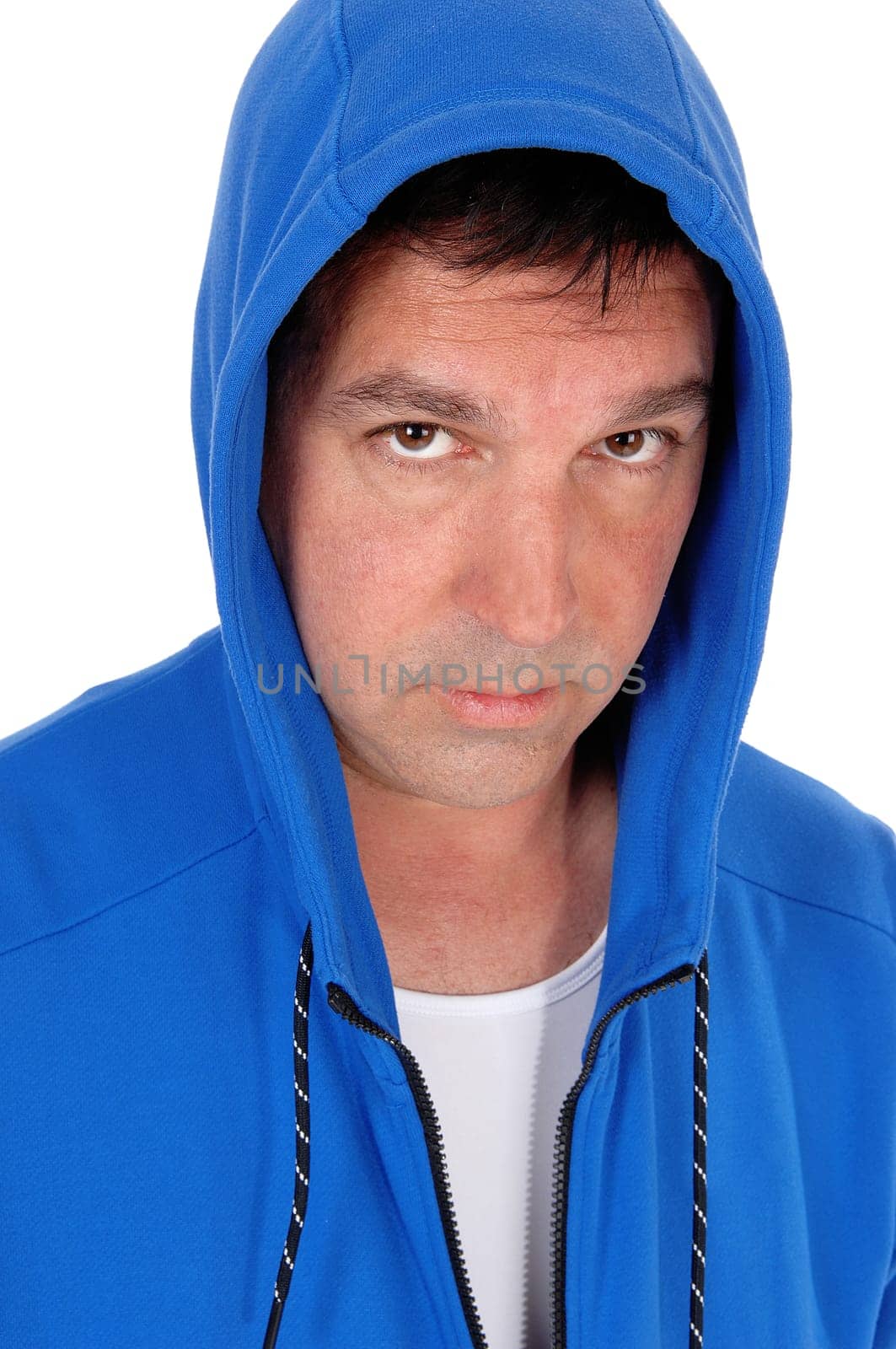 A close up image of a serious looking middle age man in a blue hoody.looking into the camera, isolated for white background.