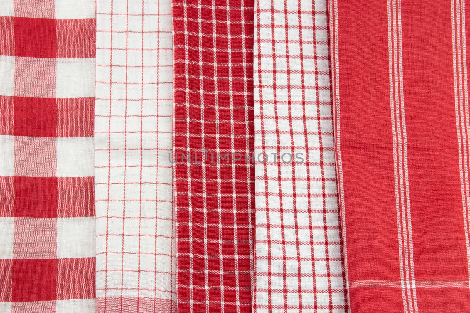 Set of 5 red and white checkered and striped napkins. Kitchen accessories.