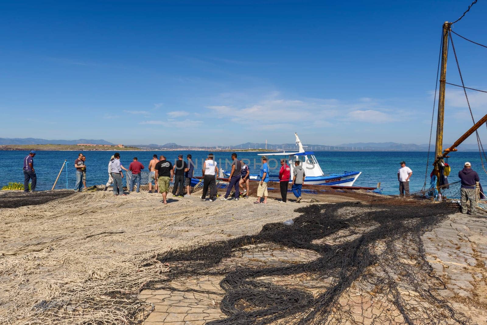 Carloforte, Island of San Pietro, Italy - 08 May 2014: "Mattanza"" is an ancient fishing technique based on nets. In Sardinia (southern Italy) there were many ""Tonnare"" to fish tuna in this way. The last active was the Tonnara of the island of San Pietro. In these scenes, fishing nets are prepared. the director of operations is called ""Rais""."