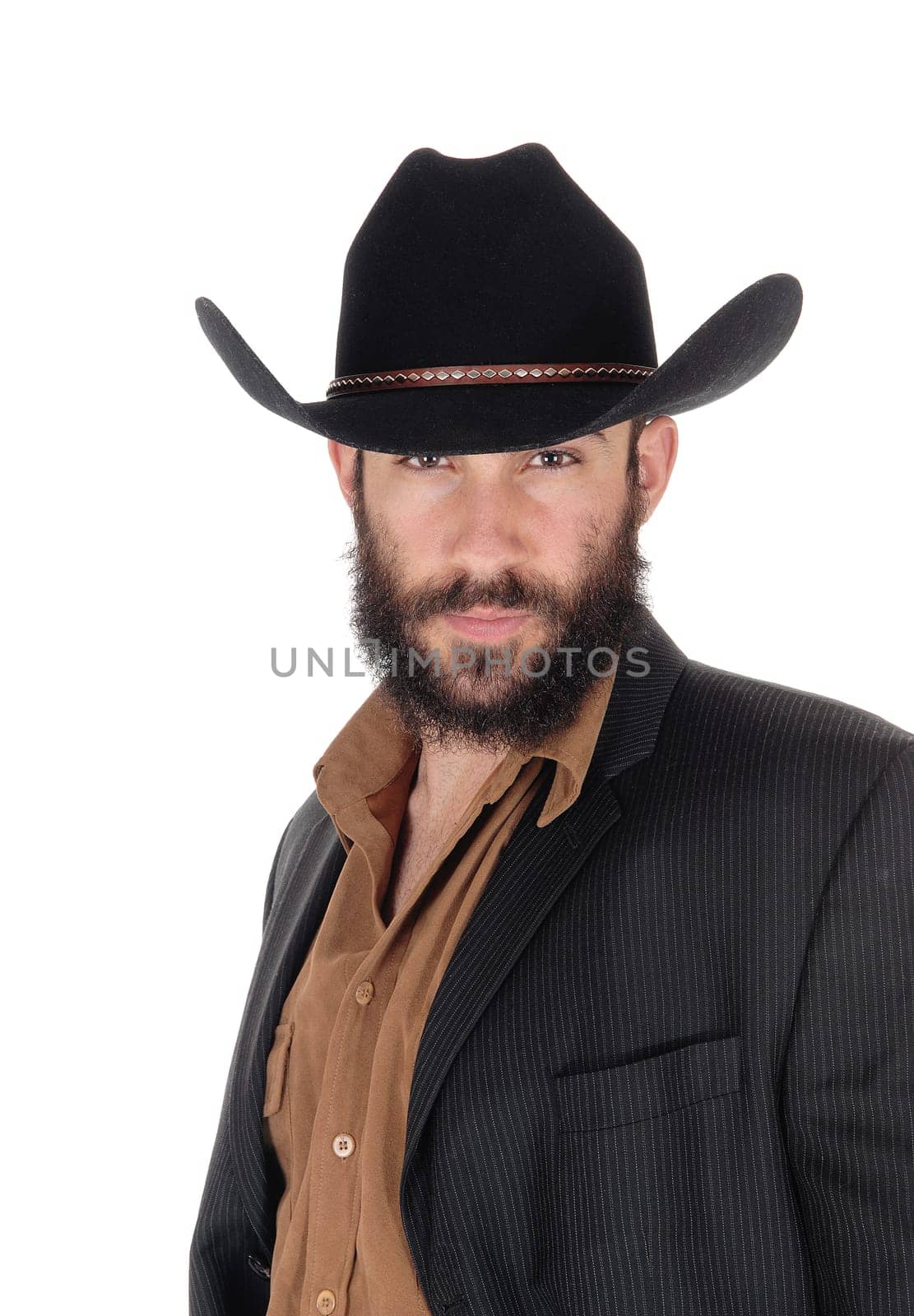A young serious looking man in a gray blazer and black cowboy hat.in a close up portrait, isolated for white background.
