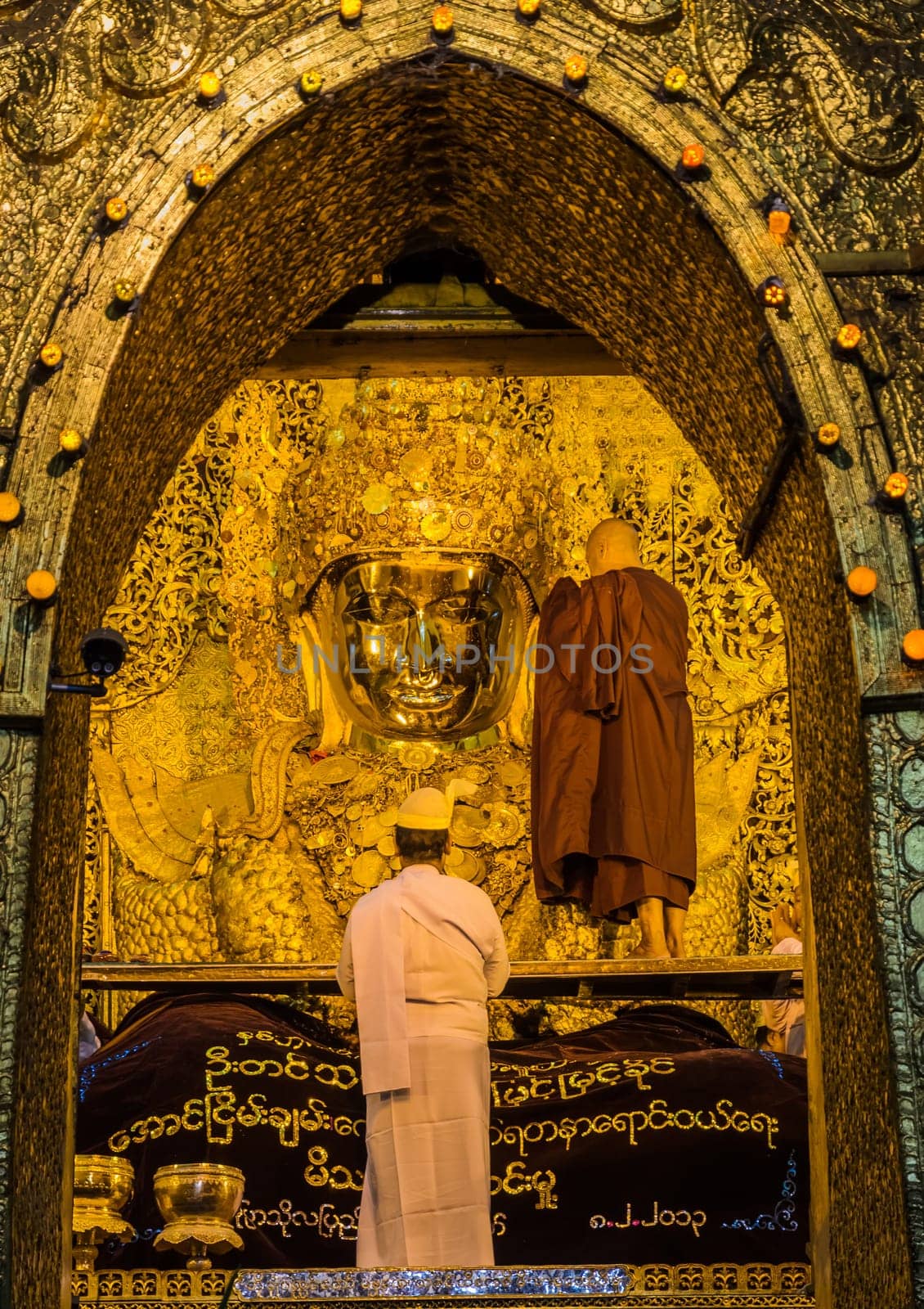 Early morning ritual of face wash to Mahamuni Buddha in Mandalay, Myanmar