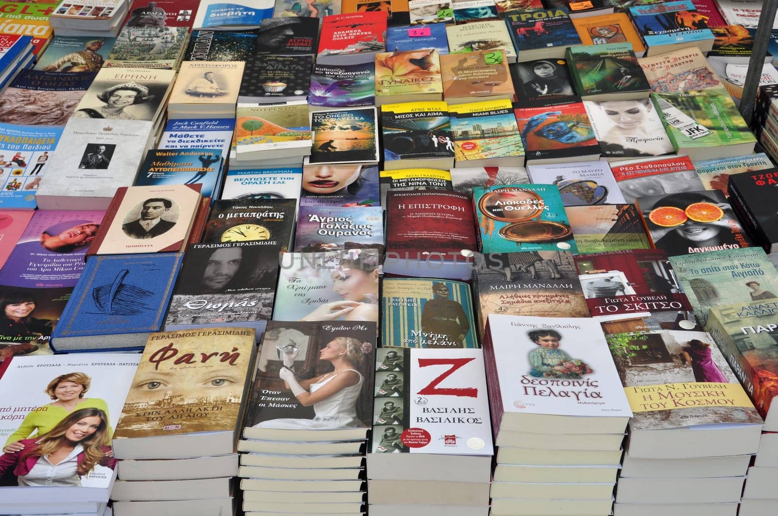 ATHENS, GREECE - AUGUST 14, 2014: Best sellers and literature books on sale at street market.