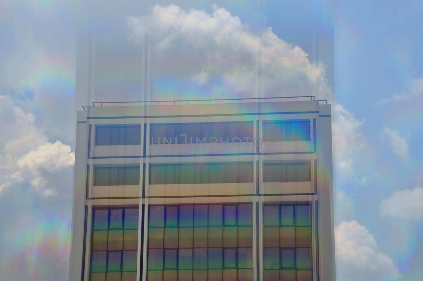 Modern building exterior motion blur through prism. Abstract architecture.