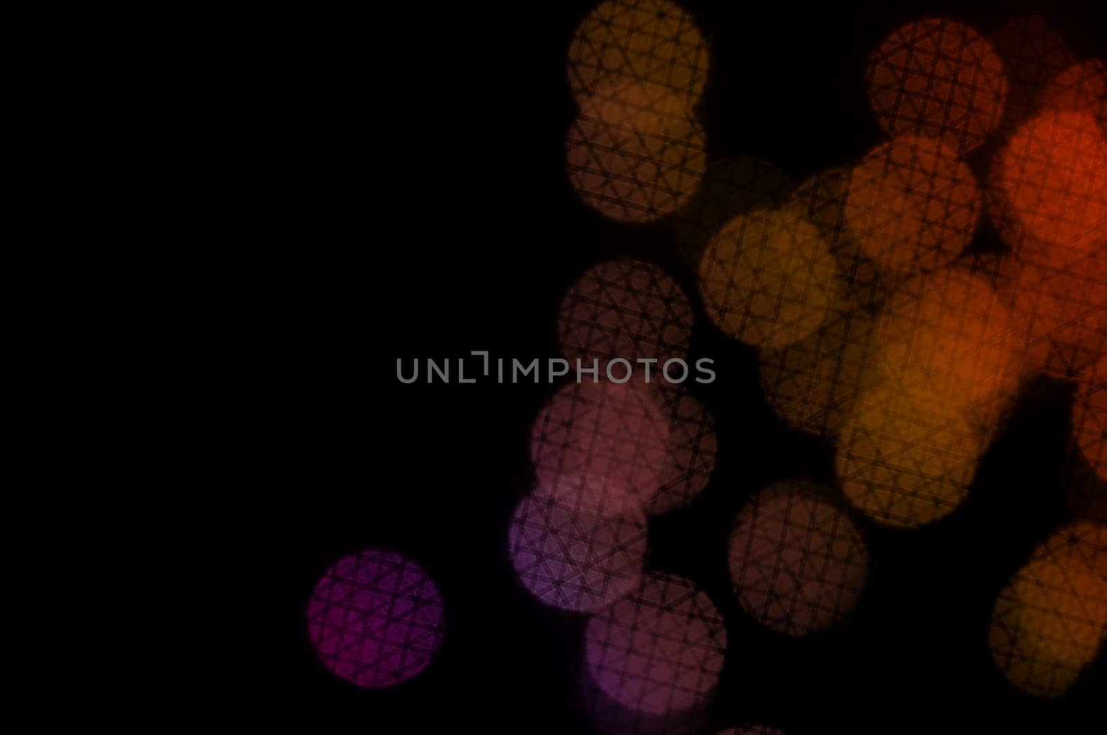 Colorful circles with crosshatch line pattern abstract blur on black background.