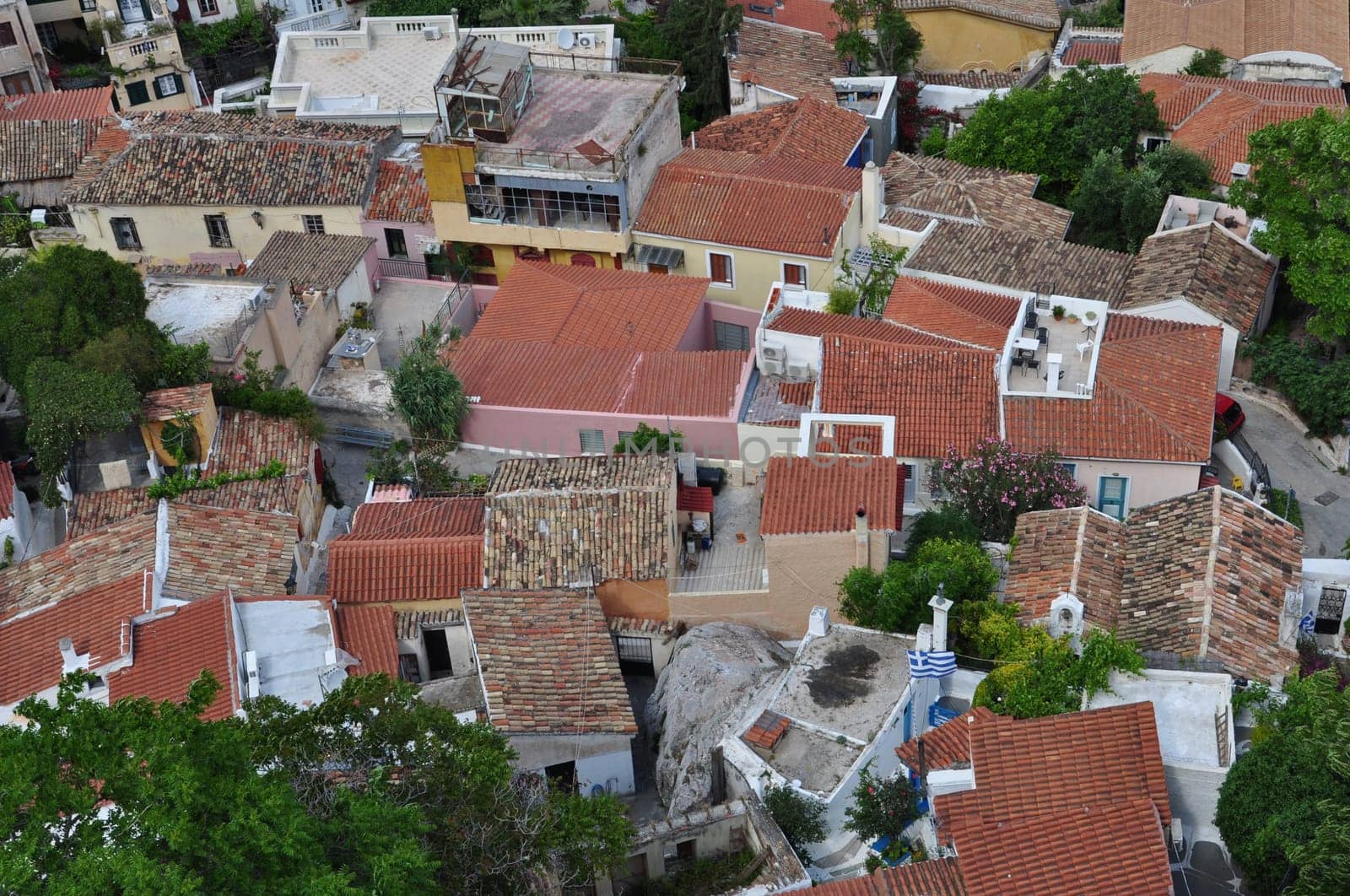 Panoramic view of the traditional Anafiotika neighborhood a maze of narrow streets and small houses built under the Acropolis by migrants from the Cycladic island of Anafi. Village style architecture in the city of Athens, Greece.