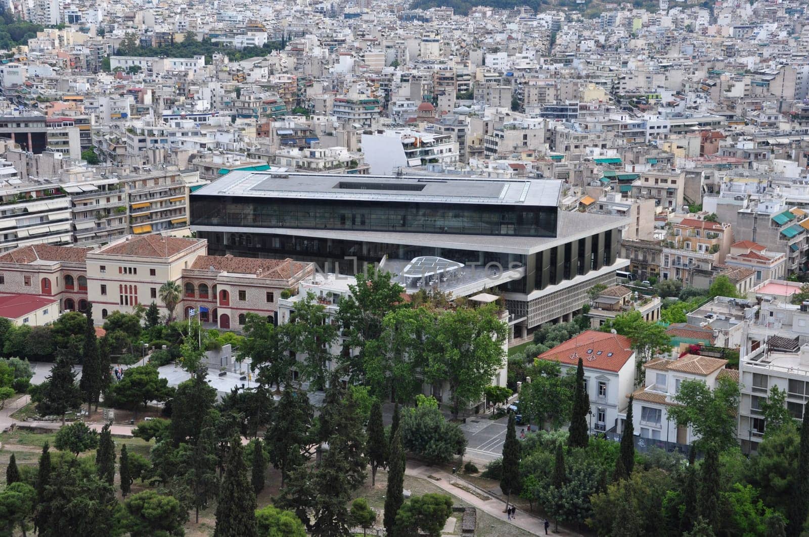 ATHENS, GREECE - MAY 6, 2014: Acropolis museum and panoramic view of downtown Athens, Greece.
