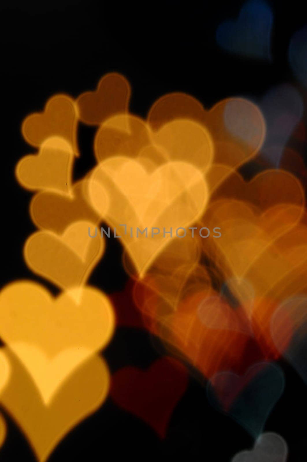Colorful hearts blurry lights at night. Valentine's day abstract background.
