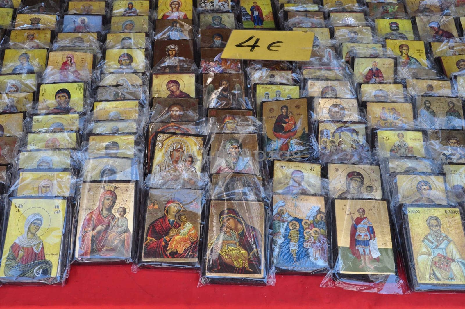 ATHENS, GREECE - AUGUST 15, 2014: Greek orthodox christian icons religious art for sale at street market.