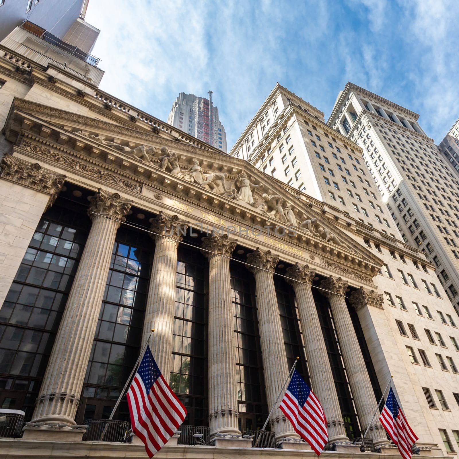 Exterior of New york Stock Exchange, largest stock exchange in world by market capitalization and most powerful global financial institute. Wall street, lower Manhattan, New York City, USA.