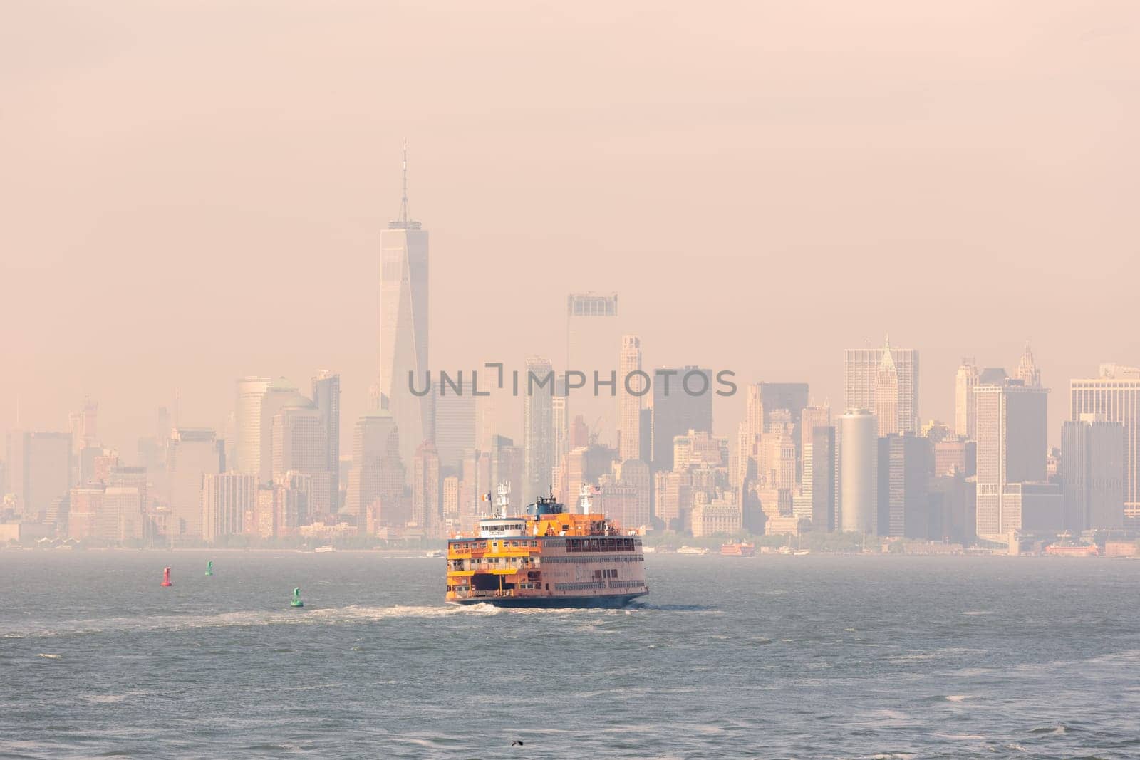 Staten Island Ferry and Lower Manhattan Skyline, New York City, USA.