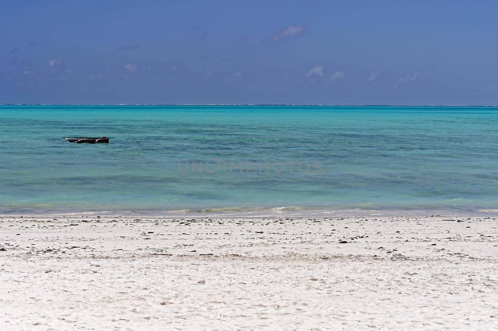 Turquoise water and sand beach at island Zanzibar