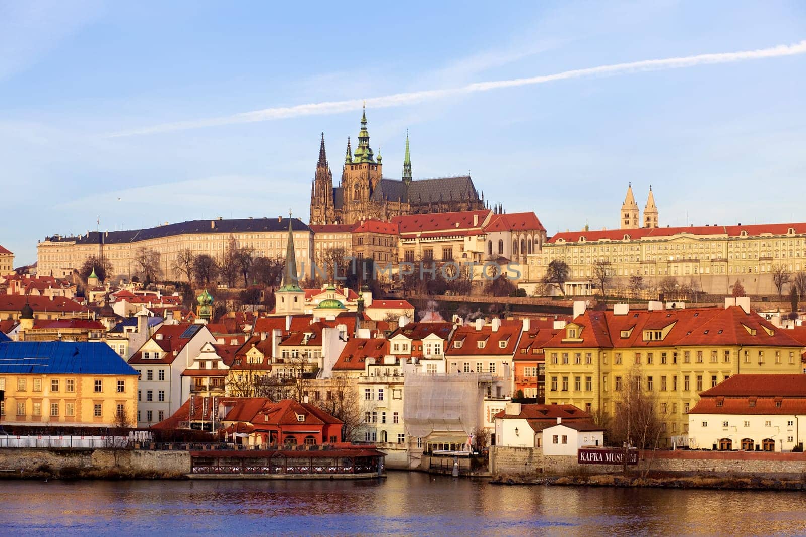 Prague St. Vitus Cathedral and Mala Strana at evening over Vltava river, Czech Republic