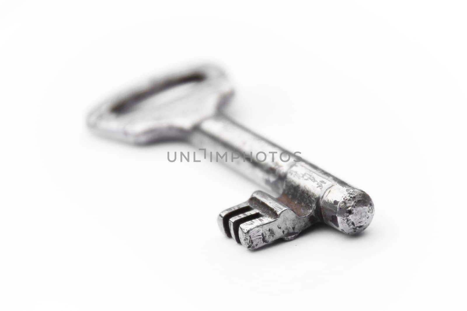 Old vintage key isolated on white background - new house key
