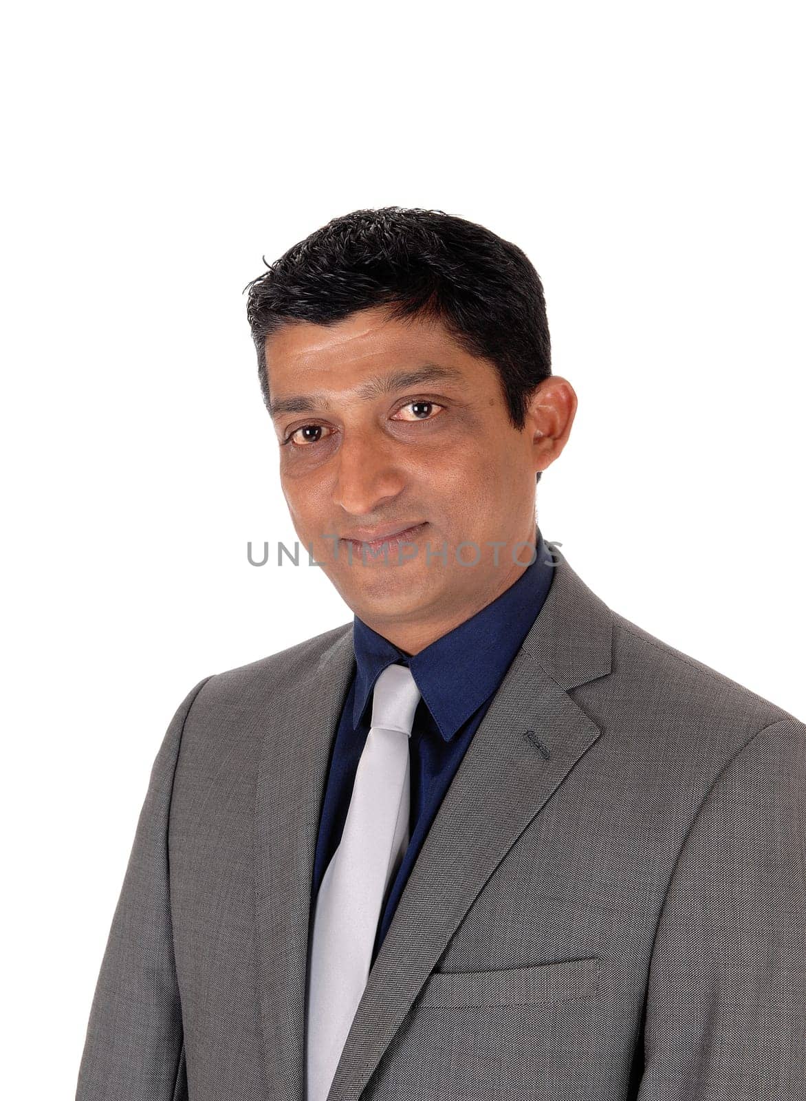 A close up image of the portrait of a east Indian business man in.a gray suit and silver tie, isolated for white background.