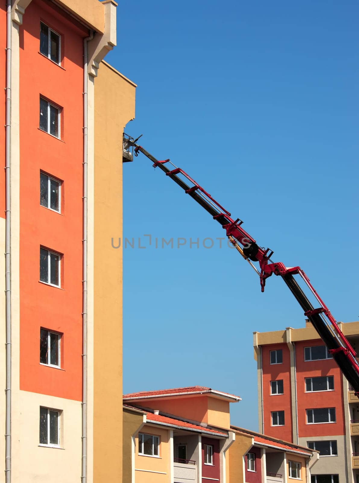 building construction site and crane over blue sky.