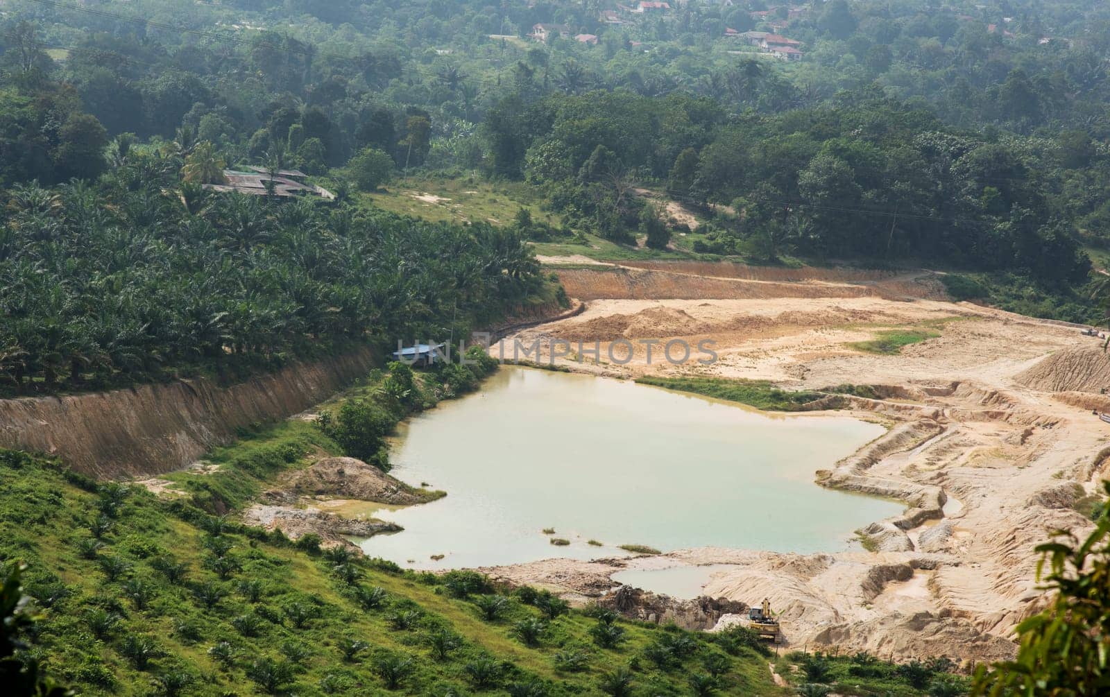 Aerial view of sand quarry and tailing ponds.