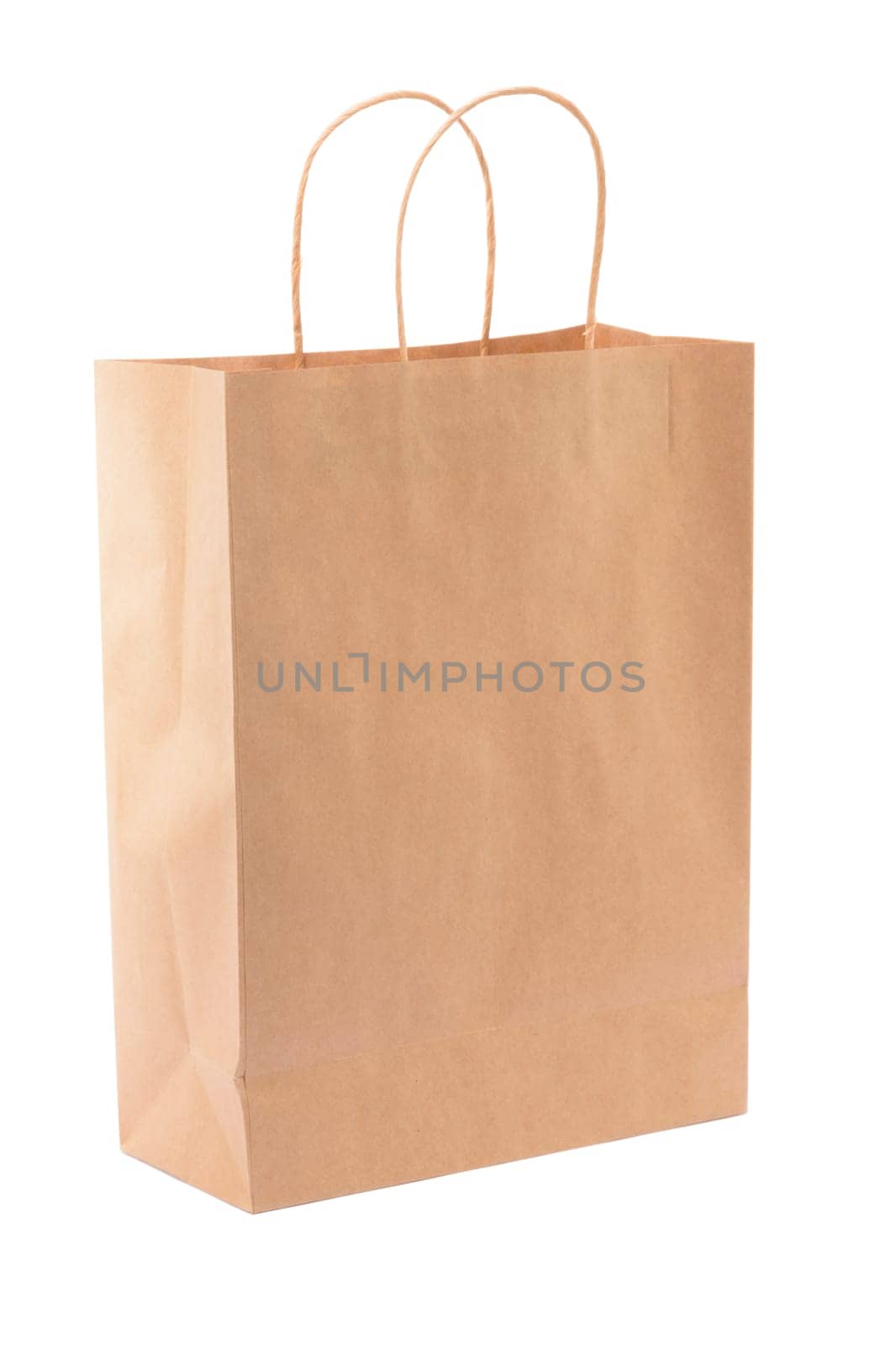 Brown paper shopping bag on white background. Empty area.
